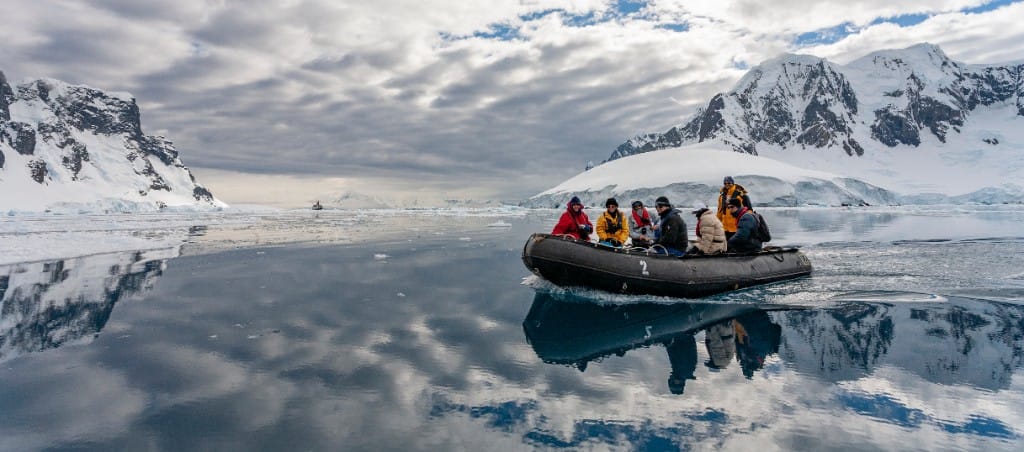Zodiac exploration among ice — luxury cruise shore experience